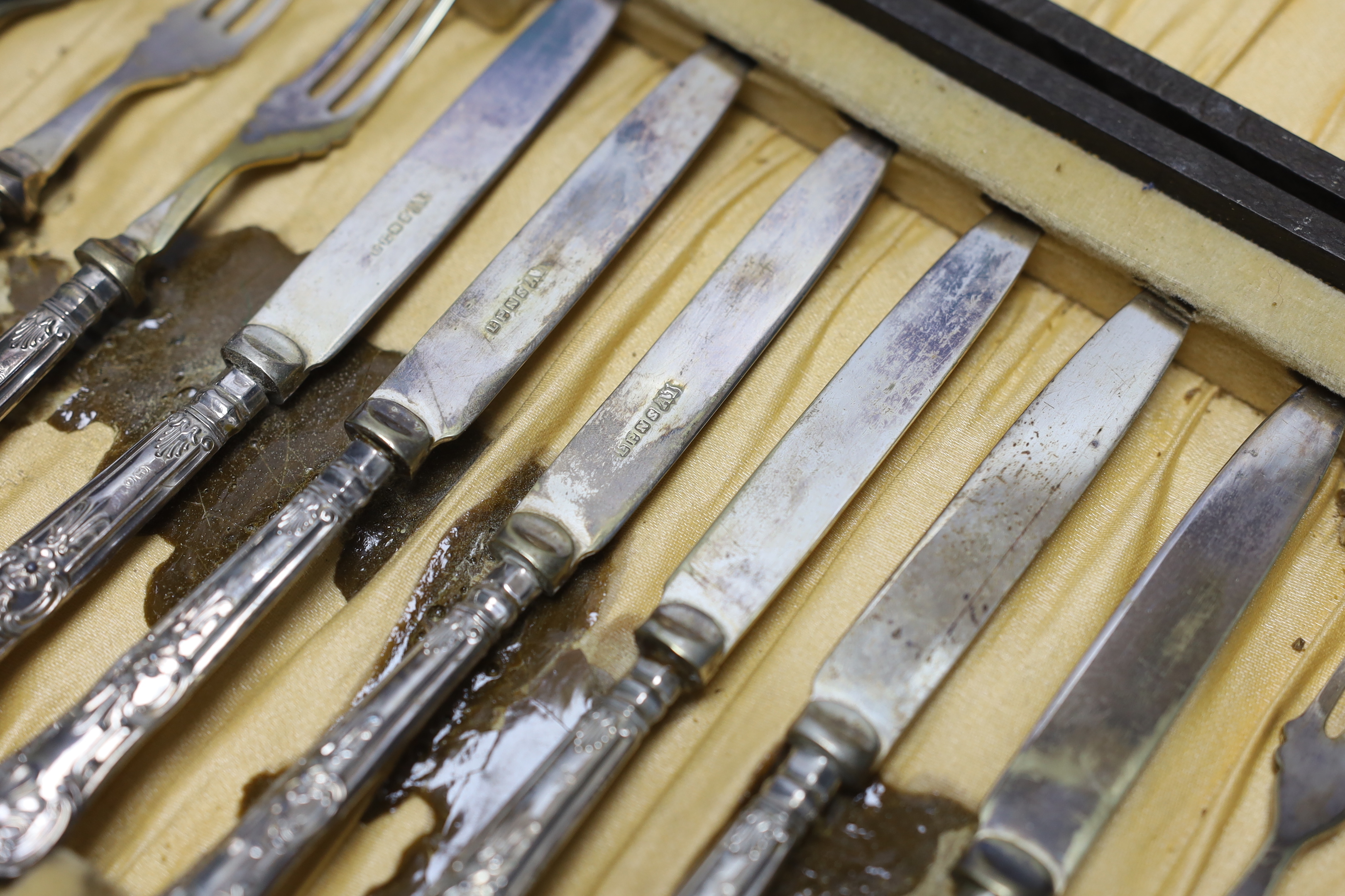 A cased set of six pairs of George V silver handled dessert eaters, C.H. Beatson, Sheffield, 1931.